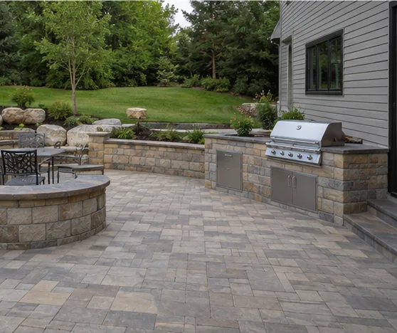 Paver patio with an outdoor kitchen and seating