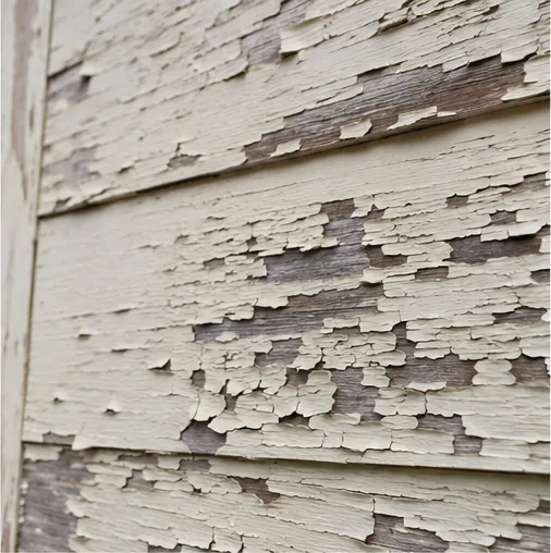 Peeling and weathered paint on wood siding