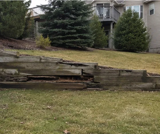 Timber retaining wall on a wooded Burnsville lot